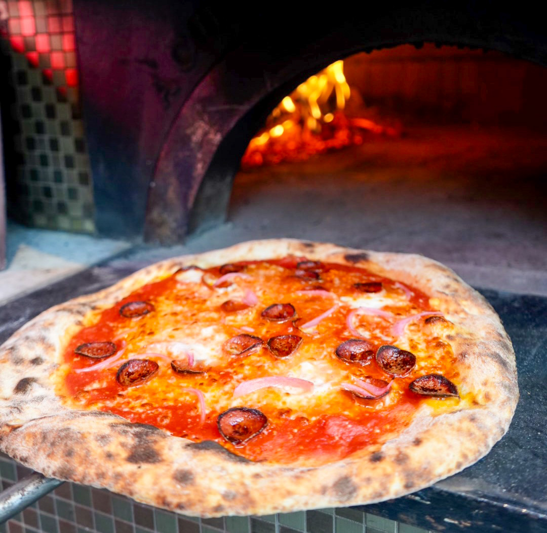 Pizza is now available at Trabert.